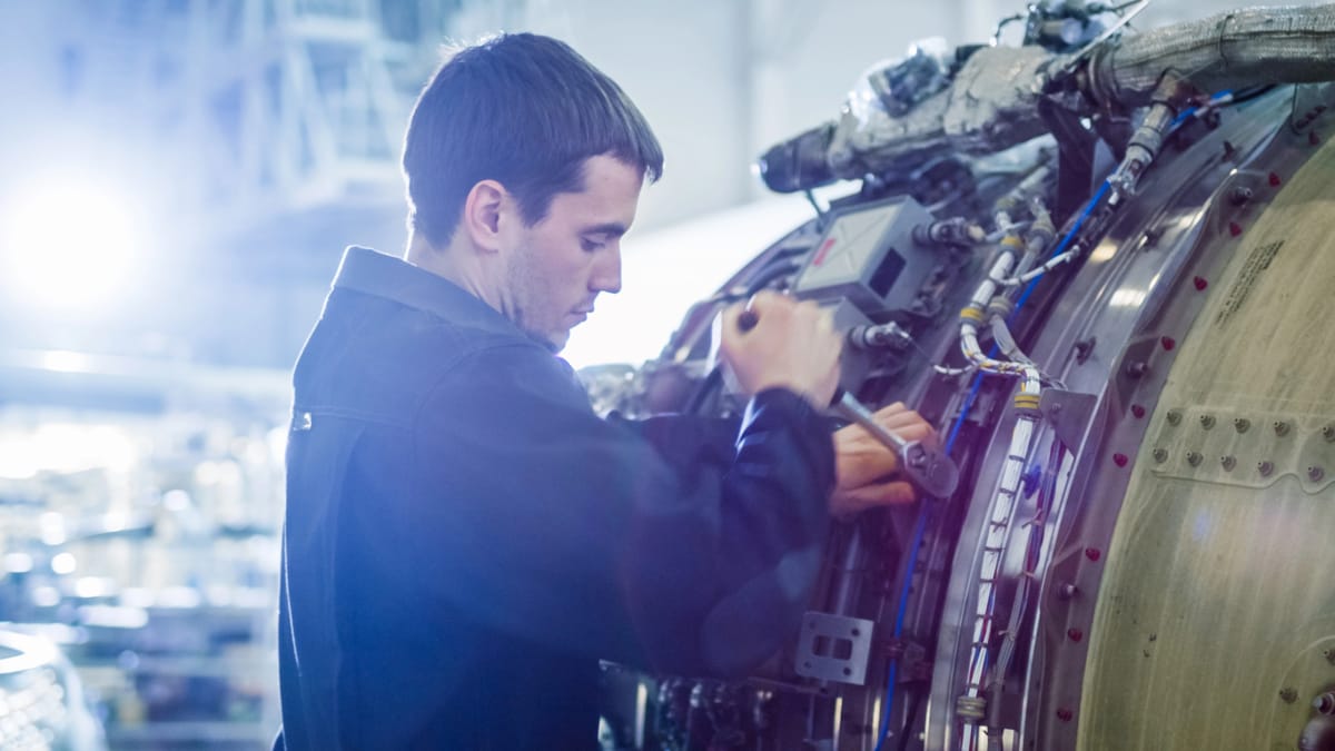 An aircraft mechanic working in his hands-on career